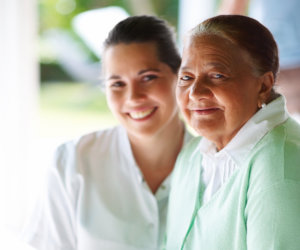 patient and caregiver smiling