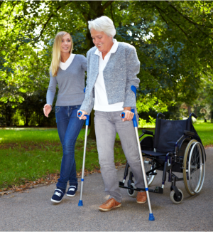 caregiver assisting patient in walking